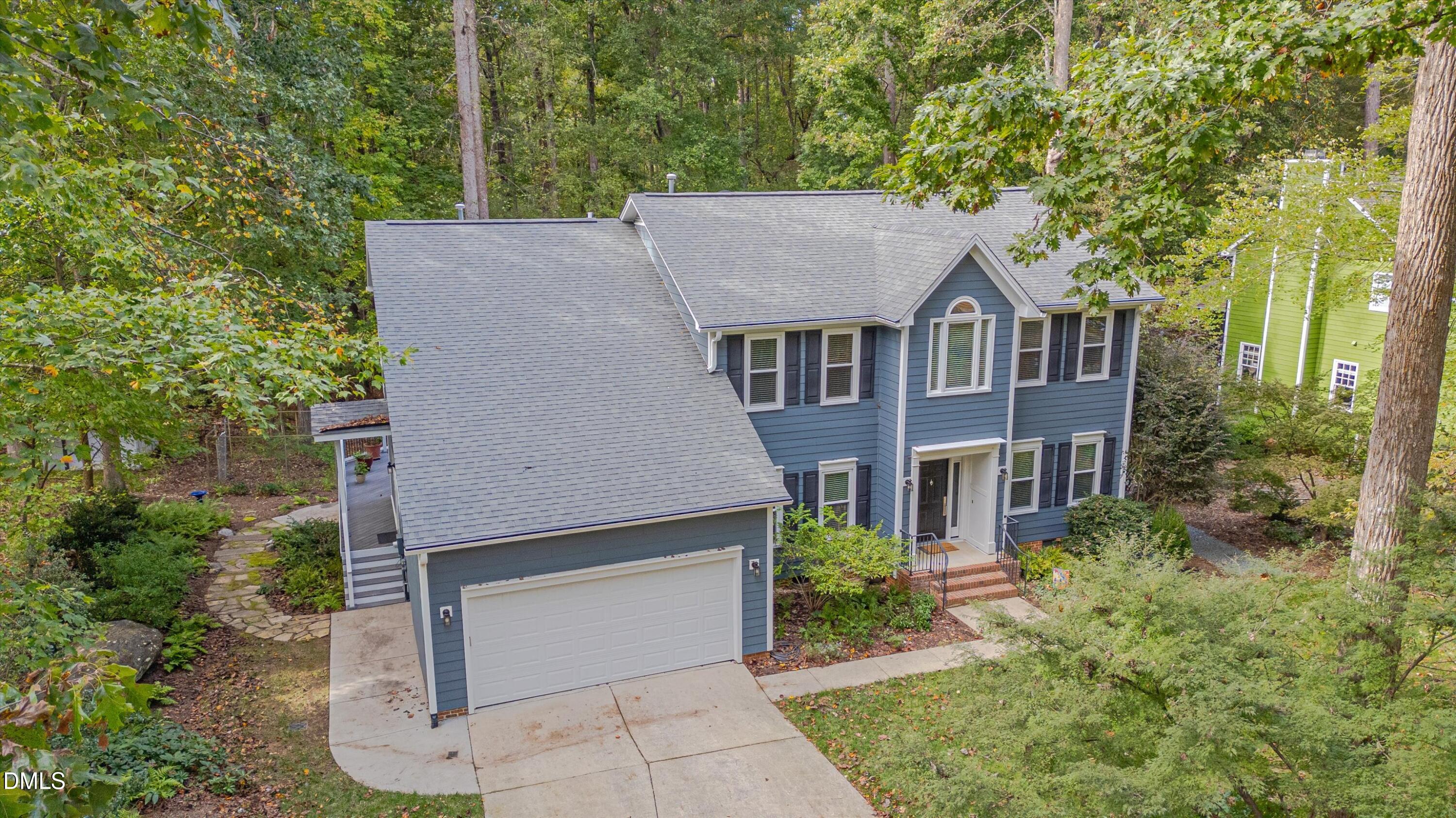 205 Cates Farm Road Chapel Hill, NC 27516 - Photo 4 of 56 aerial view of a house with a yard and large trees