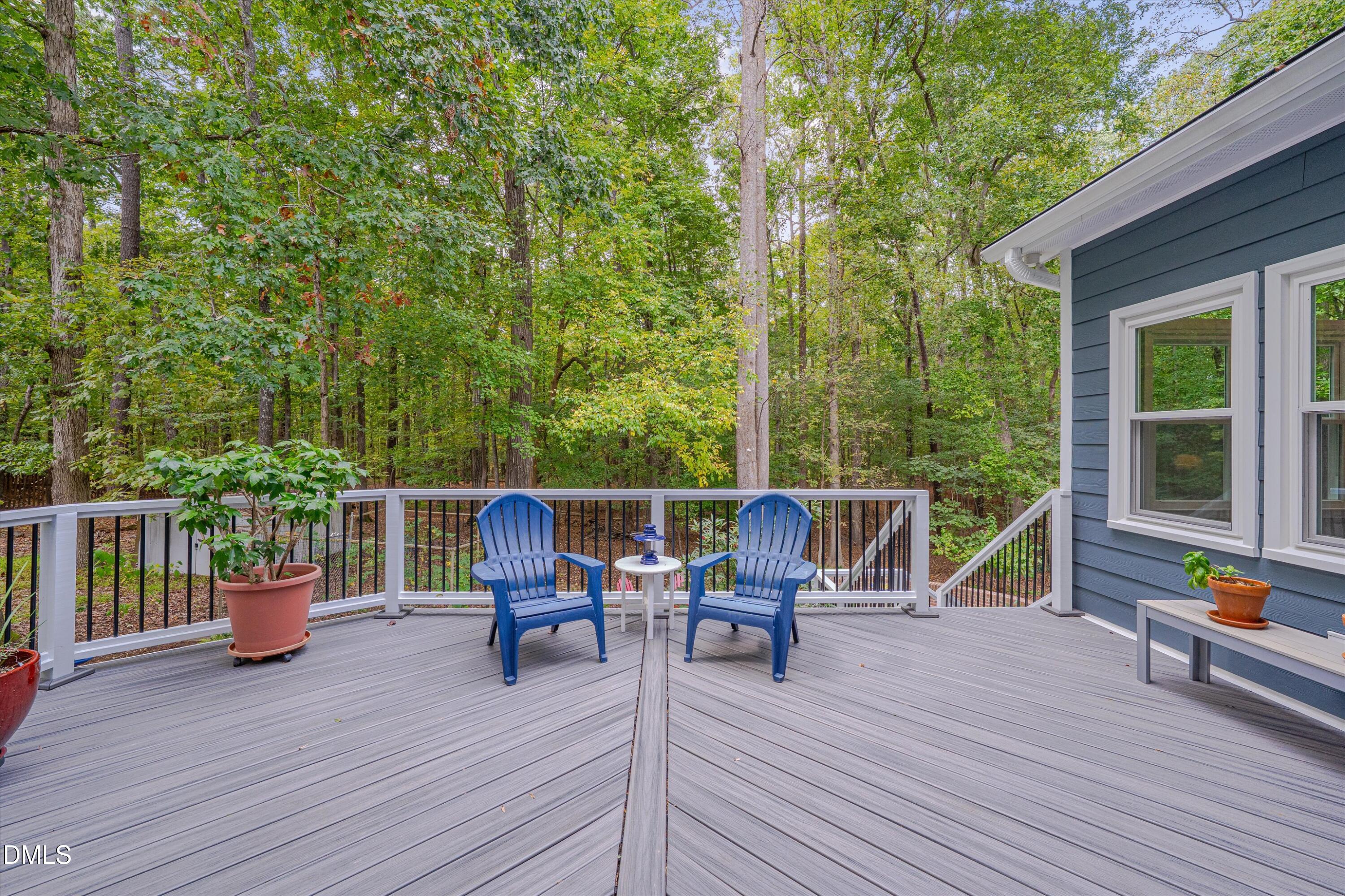 205 Cates Farm Road Chapel Hill, NC 27516 - Photo 43 of 56 a view of a deck with table and chairs and wooden floor