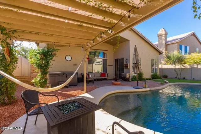 a view of swimming pool with outdoor seating and stairs