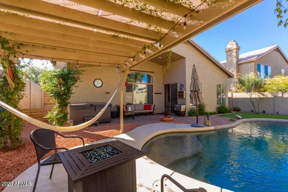 7514 East Wingspan Way Scottsdale, AZ 85255 - Photo 16 of 18 a view of swimming pool with outdoor seating and stairs