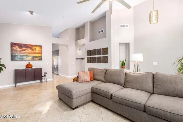 a living room with furniture and a window