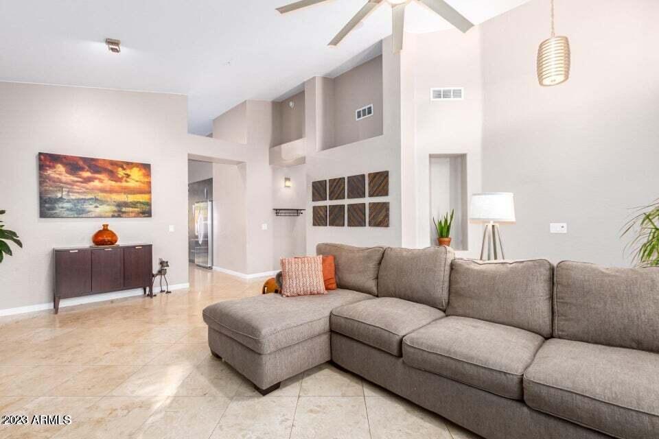 7514 East Wingspan Way Scottsdale, AZ 85255 - Photo 4 of 18 a living room with furniture and a window