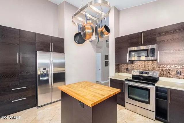 a kitchen with a stove and a refrigerator