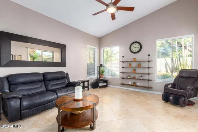 a living room with furniture and a large window