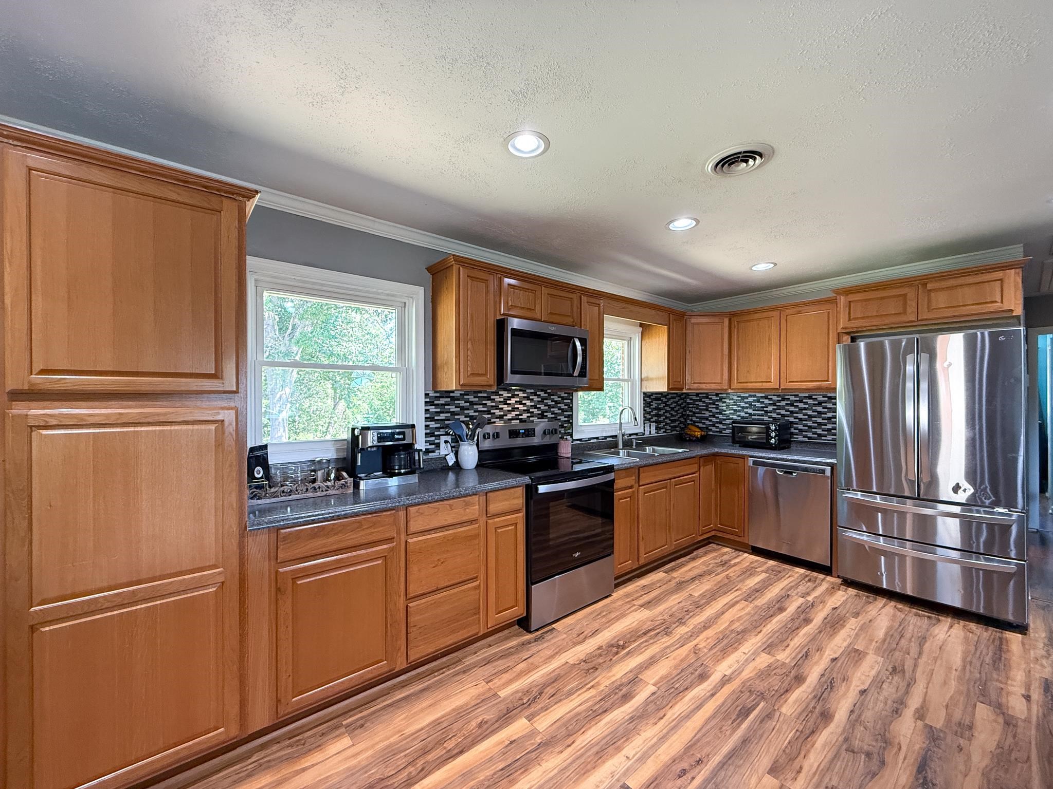 39 View Drive Stuarts Draft, VA 24477 - Photo 9 of 25 a kitchen with stainless steel appliances granite countertop a refrigerator stove and sink