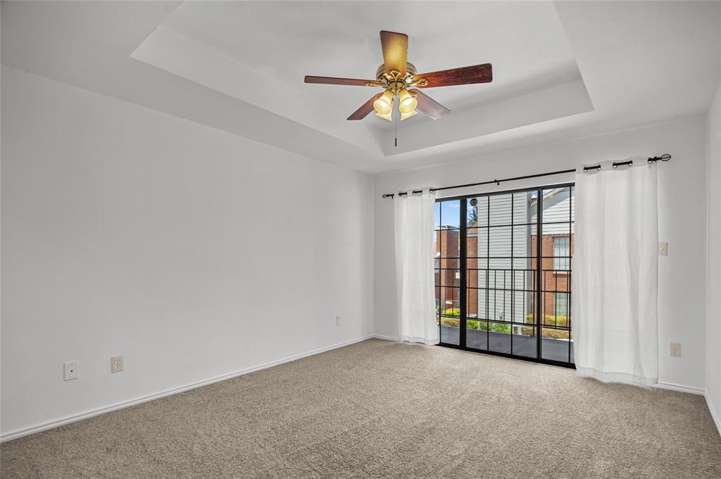 5100 Verde Valley Lane, Unit 245 Dallas, TX 75254 - Photo 14 of 24 a view of an empty room with a window