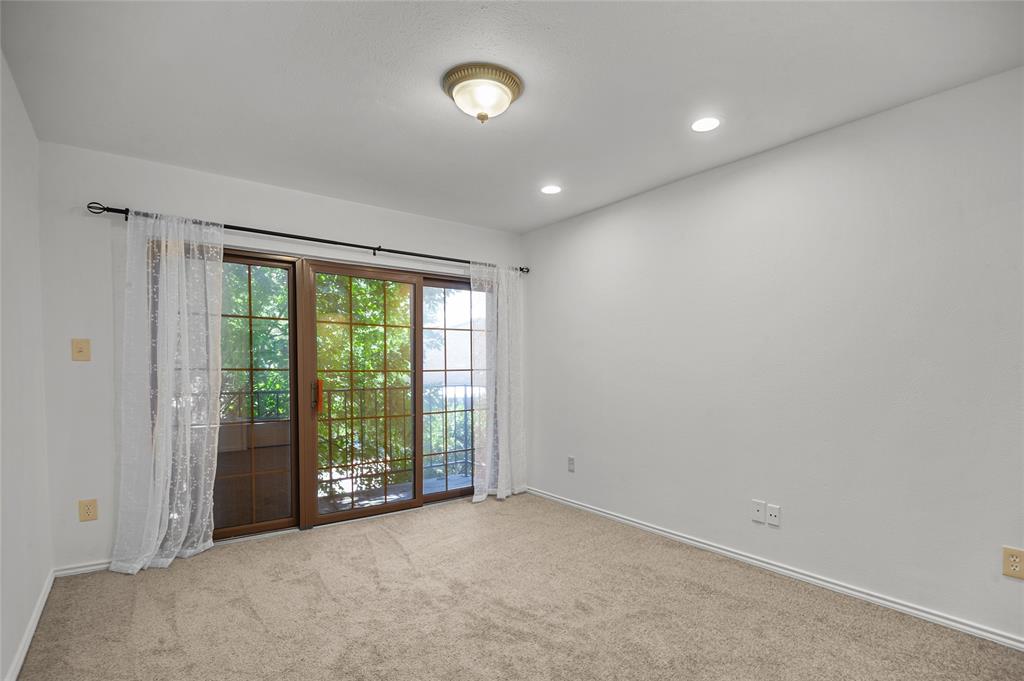 5100 Verde Valley Lane, Unit 245 Dallas, TX 75254 - Photo 18 of 24 a view of an empty room with a window