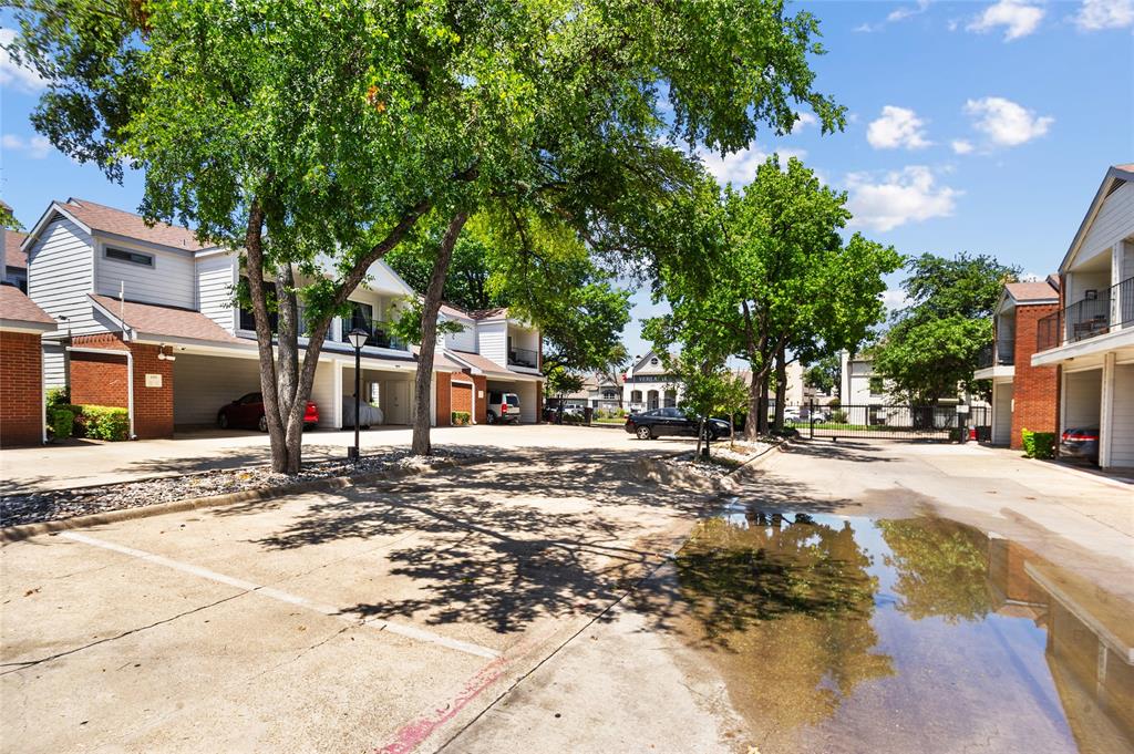 5100 Verde Valley Lane, Unit 245 Dallas, TX 75254 - Photo 20 of 24 a view of street with houses
