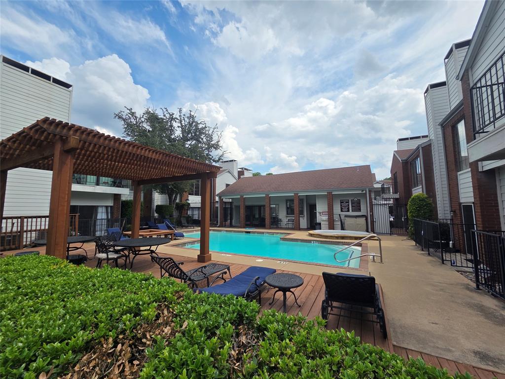 5100 Verde Valley Lane, Unit 245 Dallas, TX 75254 - Photo 22 of 24 a front view of a house with garden and sitting area