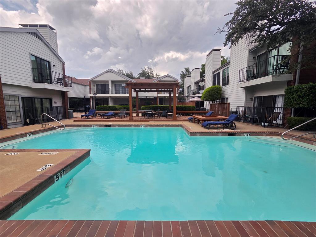5100 Verde Valley Lane, Unit 245 Dallas, TX 75254 - Photo 24 of 24 a view of a house with sitting area and swimming pool