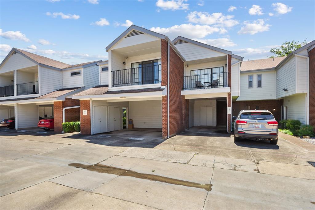 5100 Verde Valley Lane, Unit 245 Dallas, TX 75254 - Photo 3 of 24 a car parked in front of white building