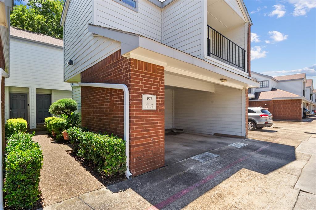 5100 Verde Valley Lane, Unit 245 Dallas, TX 75254 - Photo 5 of 24 a view of a house with a yard