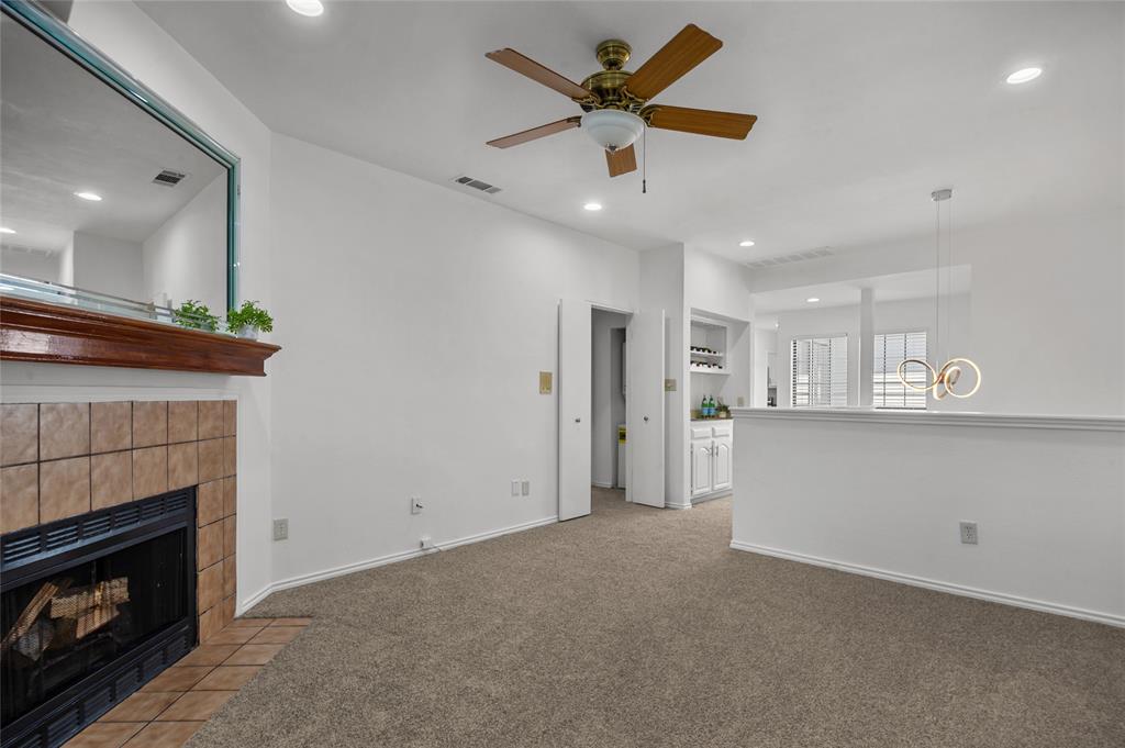 5100 Verde Valley Lane, Unit 245 Dallas, TX 75254 - Photo 7 of 24 a view of an empty room with a fireplace