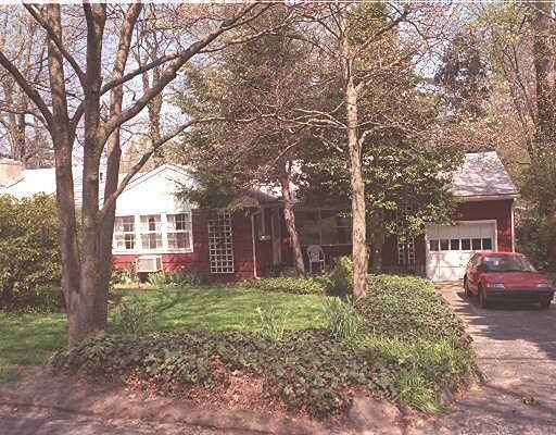 14 Spicewood Road Norwalk, CT 06854 - Photo 1 of 1 a house is sitting in middle of forest