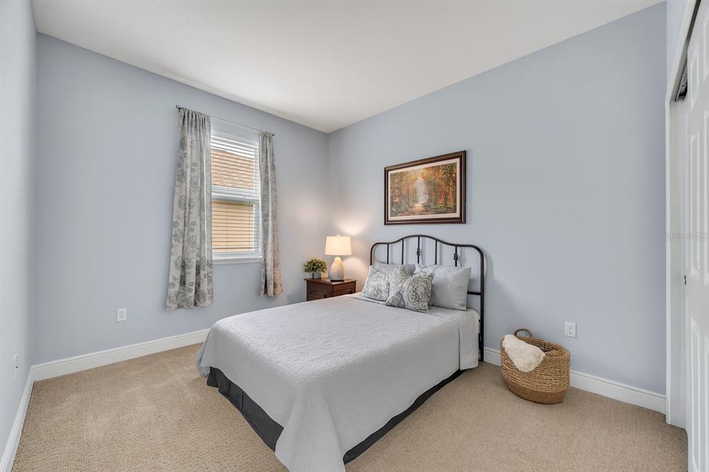 134 Silver Maple Road Groveland, FL 34736 - Photo 32 of 73 a bedroom with a bed and a window