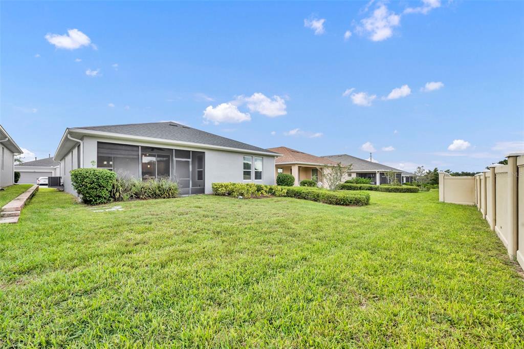 134 Silver Maple Road Groveland, FL 34736 - Photo 38 of 73 a front view of a house with a yard