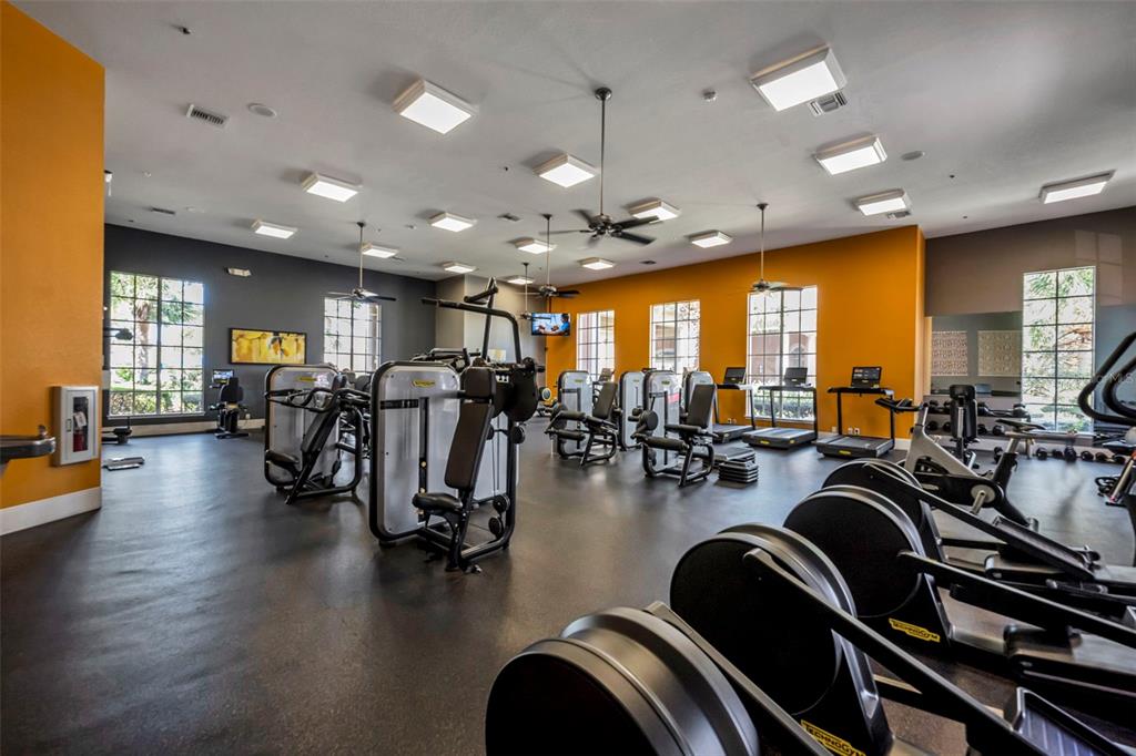 134 Silver Maple Road Groveland, FL 34736 - Photo 45 of 73 a view of a room with gym equipment and wooden floor
