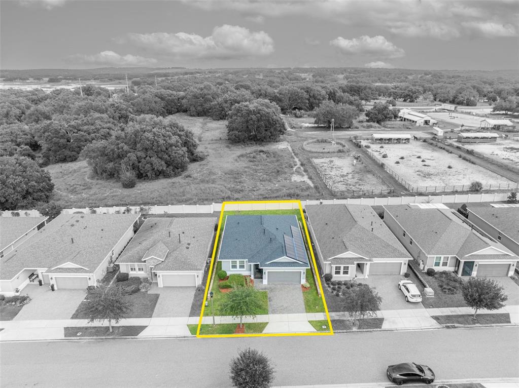 134 Silver Maple Road Groveland, FL 34736 - Photo 57 of 73 an aerial view of residential houses with outdoor space