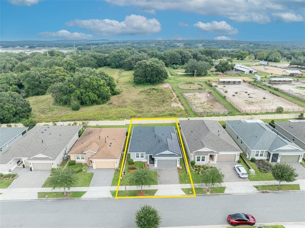 134 Silver Maple Road Groveland, FL 34736 - Photo 58 of 73 an aerial view of residential houses with outdoor space and parking