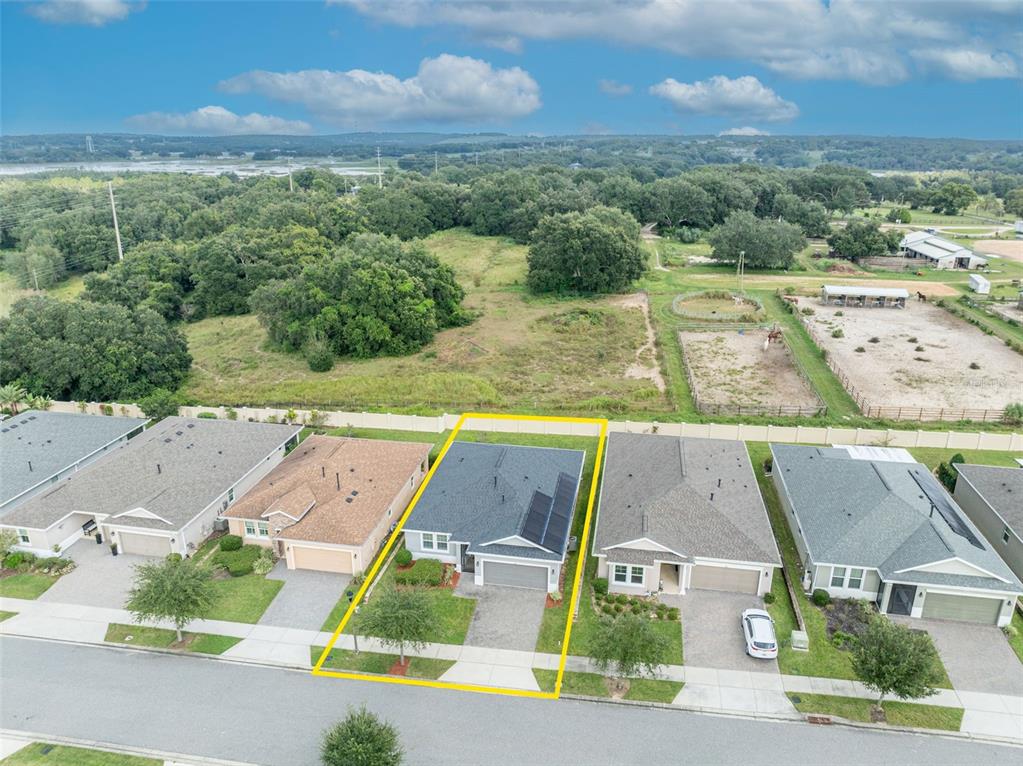 134 Silver Maple Road Groveland, FL 34736 - Photo 61 of 73 an aerial view of residential houses with outdoor space and street view