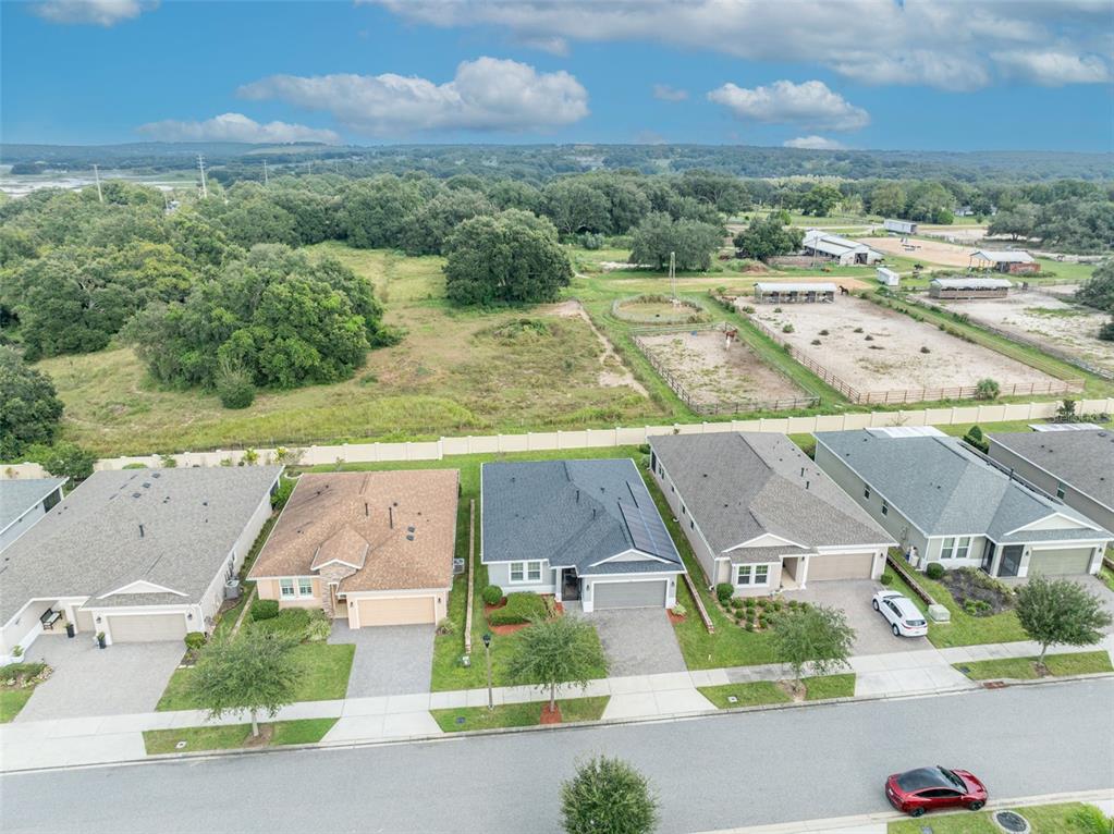 134 Silver Maple Road Groveland, FL 34736 - Photo 63 of 73 an aerial view of residential houses with outdoor space and street view