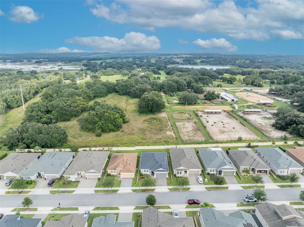 134 Silver Maple Road Groveland, FL 34736 - Photo 65 of 73 an aerial view of residential houses with outdoor space and street view