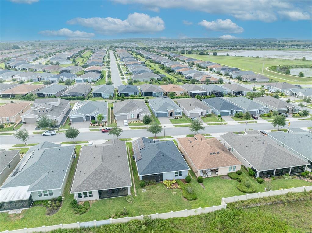 134 Silver Maple Road Groveland, FL 34736 - Photo 73 of 73 an aerial view of residential houses with outdoor space and ocean view