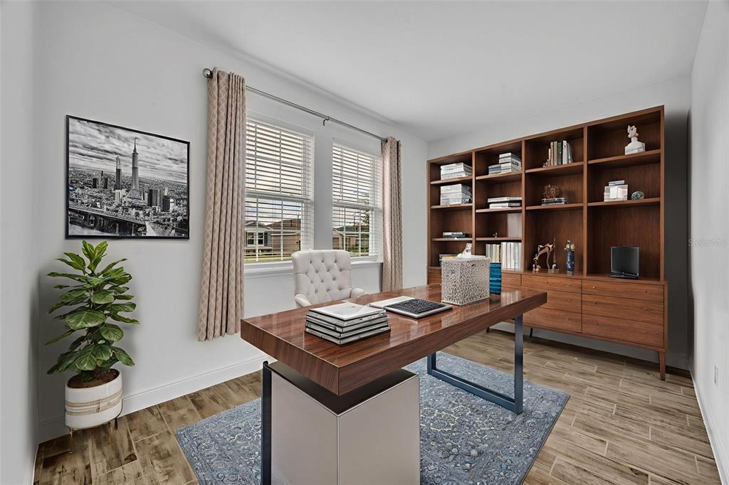 134 Silver Maple Road Groveland, FL 34736 - Photo 9 of 73 a living room with furniture and a potted plant