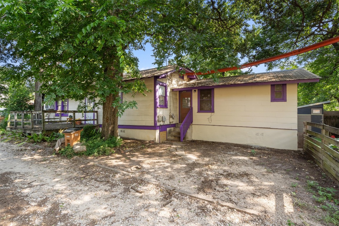 3404 Grooms Street, Unit B Austin, TX 78705 - Photo 1 of 11 View of front of property with crawl space, fence, and metal roof