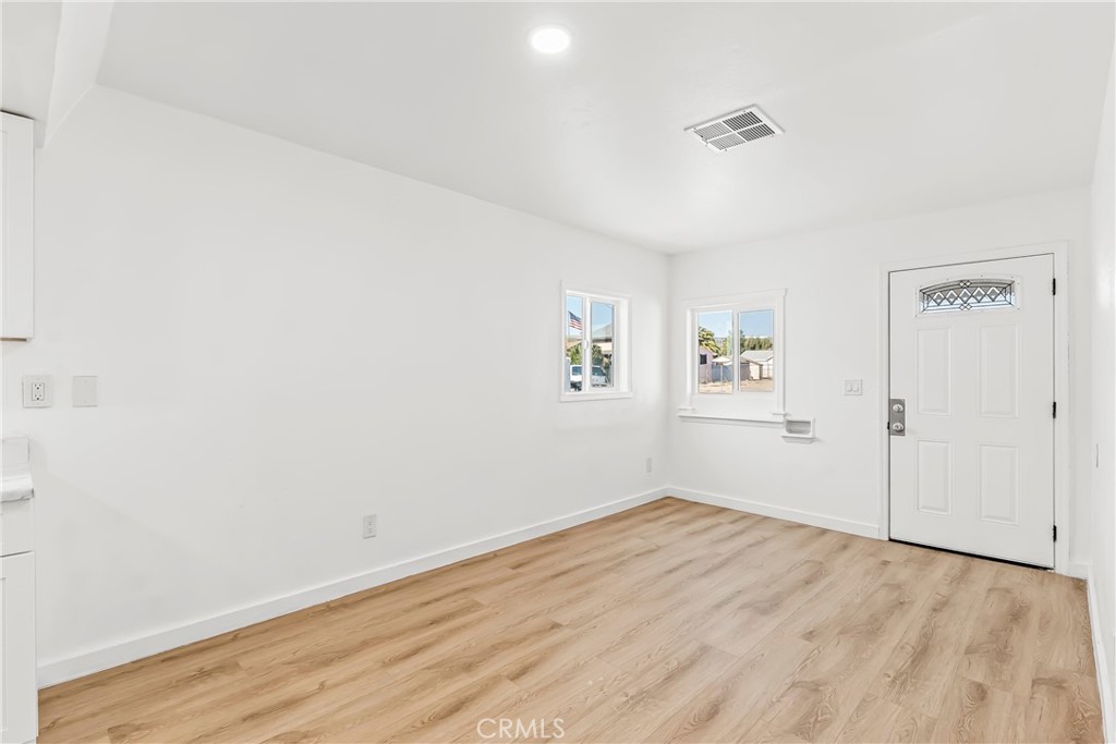 129 North K Street Needles, CA 92363 - Photo 2 of 39 wooden floor in an empty room