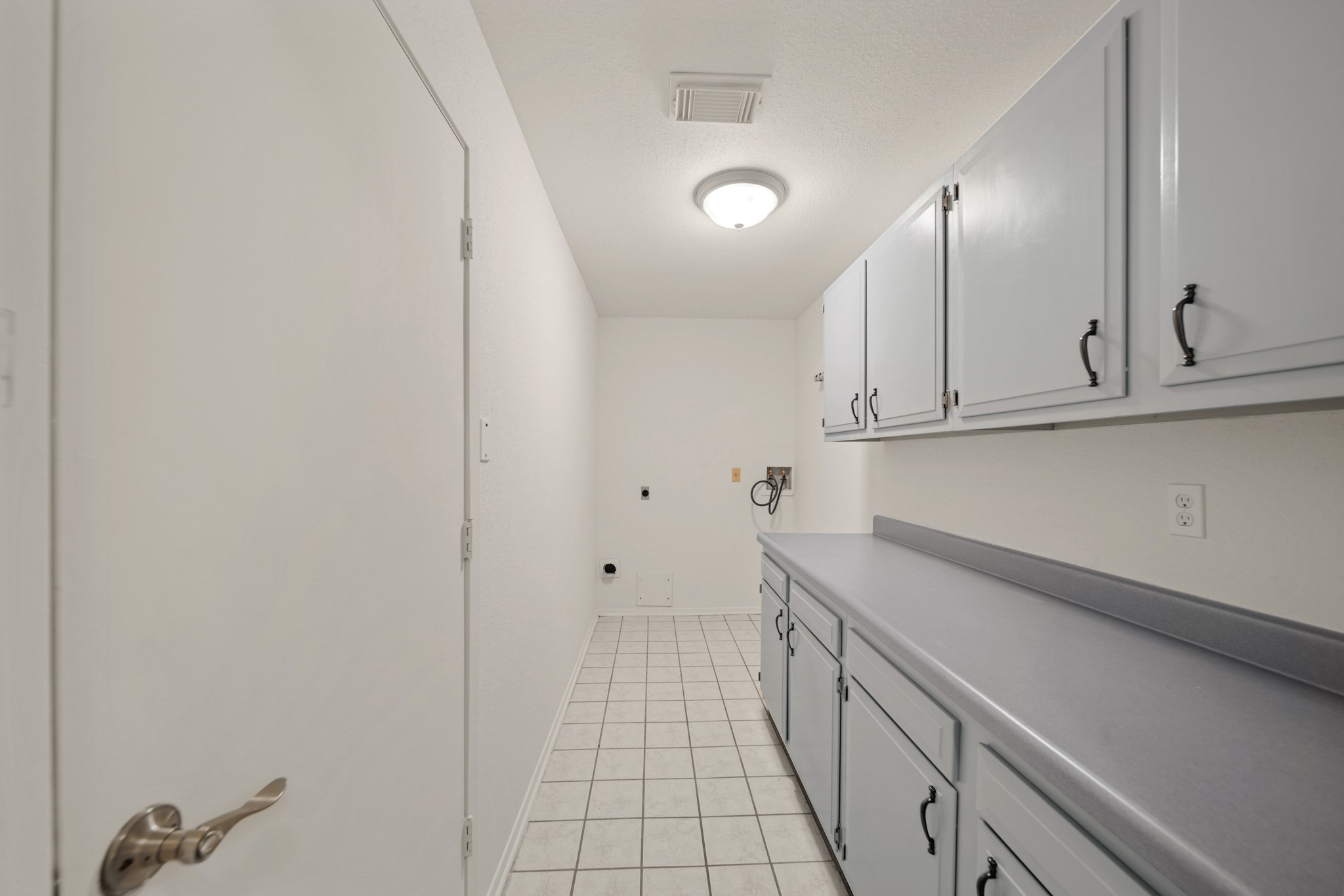 9903 Robin Street La Porte, TX 77571 - Photo 12 of 25 a view of a kitchen with white cabinets