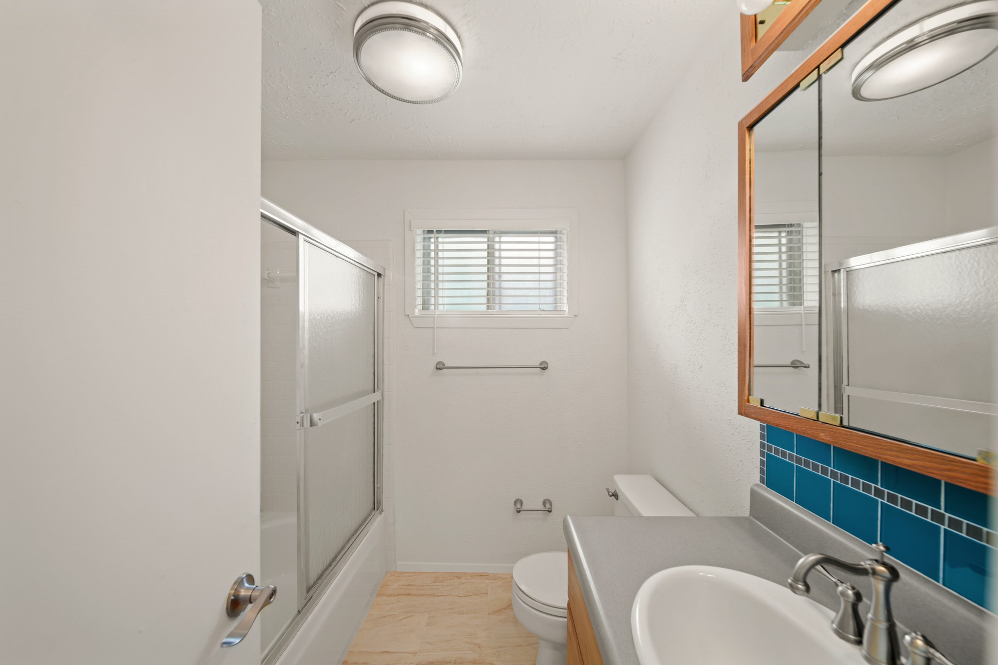 9903 Robin Street La Porte, TX 77571 - Photo 20 of 25 a bathroom with a granite countertop sink mirror vanity and toilet