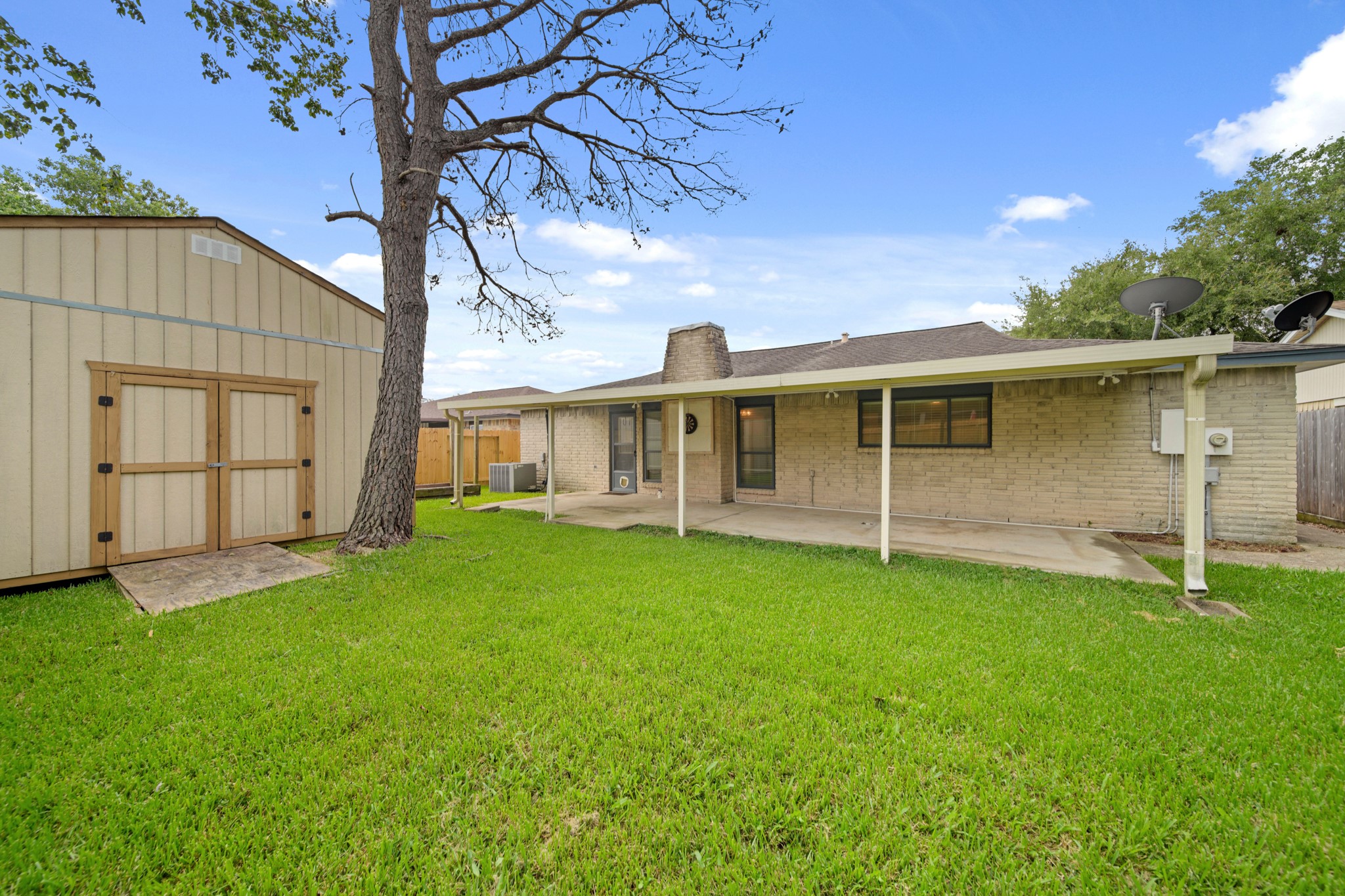 9903 Robin Street La Porte, TX 77571 - Photo 23 of 25 a view of a house with a backyard