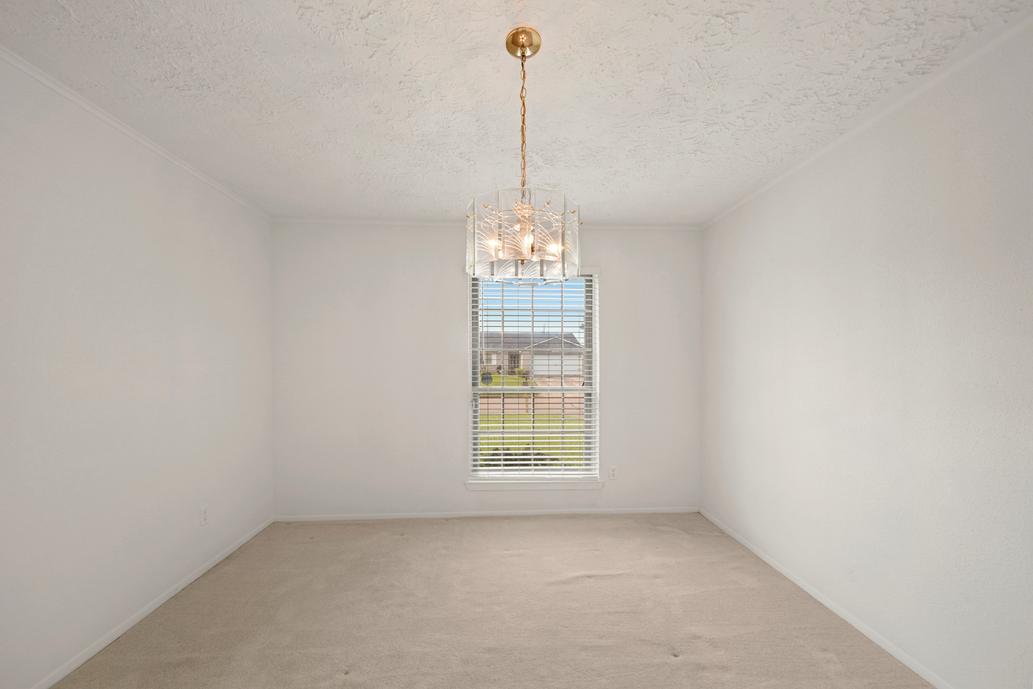 9903 Robin Street La Porte, TX 77571 - Photo 7 of 25 a view of a room with windows and chandelier