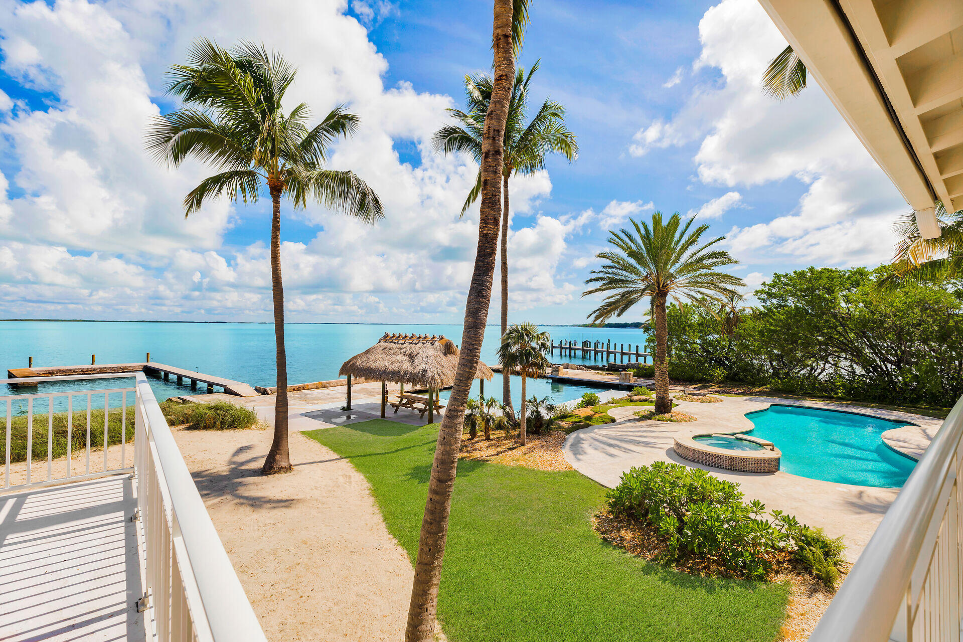 36 Sunset Road Key Largo, FL 33037 - Photo 13 of 55 an ocean view with beach and patio