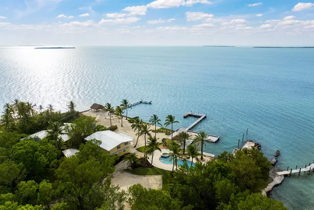 a view of swimming pool with a table and chairs
