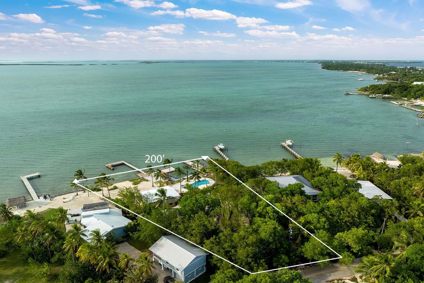 36 Sunset Road Key Largo, FL 33037 - Photo 20 of 55 a view of a lake with a yard
