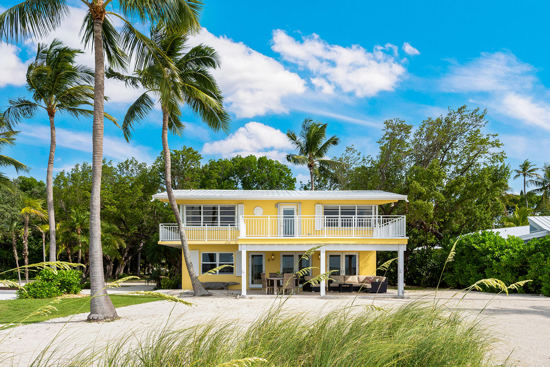 36 Sunset Road Key Largo, FL 33037 - Photo 24 of 55 a front view of a house with a garden