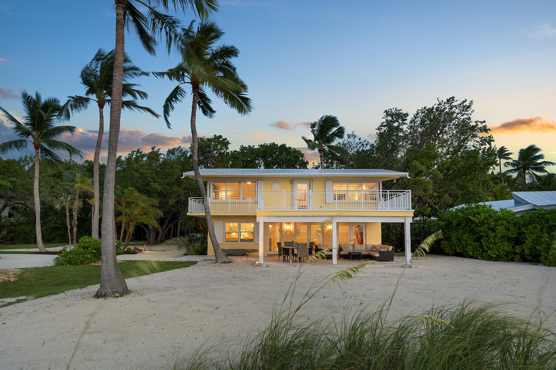 36 Sunset Road Key Largo, FL 33037 - Photo 28 of 55 a front view of a house with a yard and garage