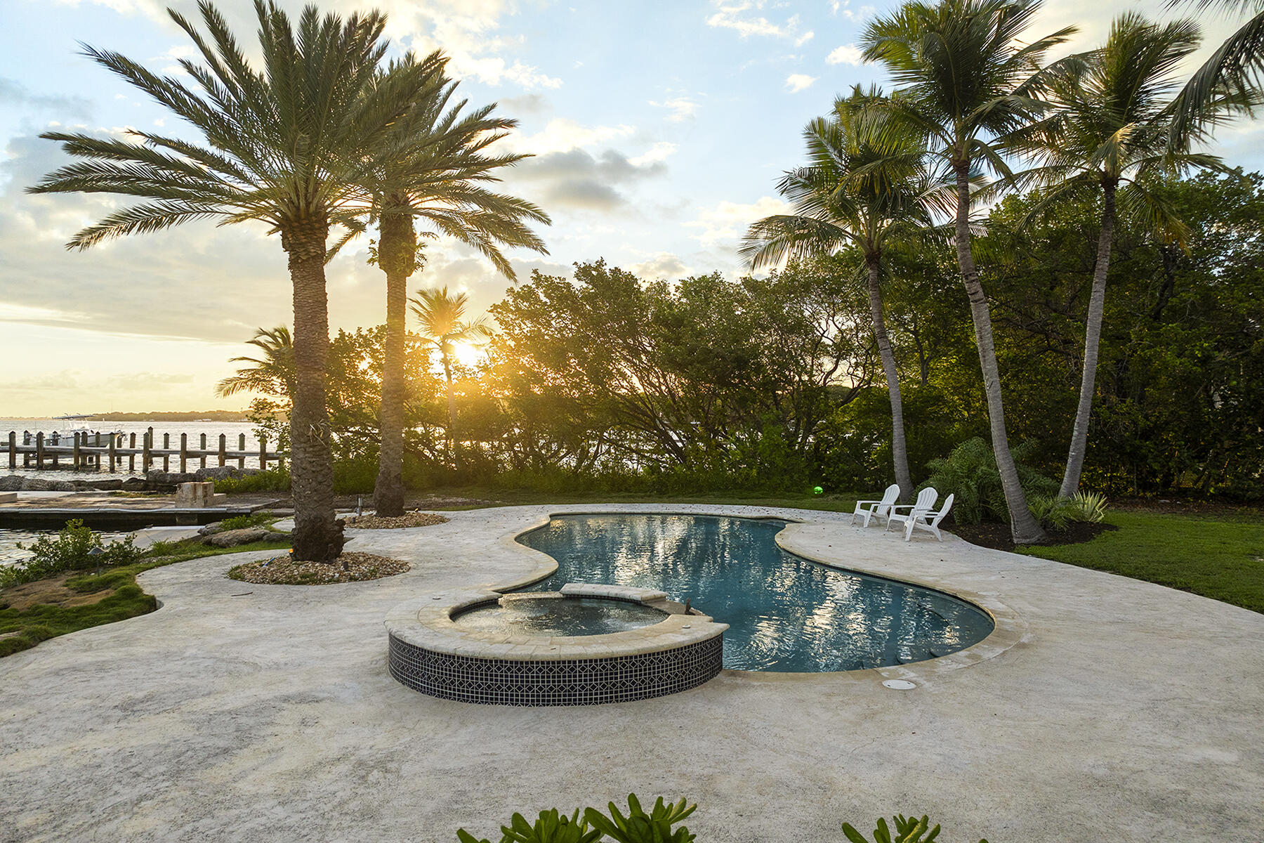 36 Sunset Road Key Largo, FL 33037 - Photo 30 of 55 a view of a swimming pool with a patio
