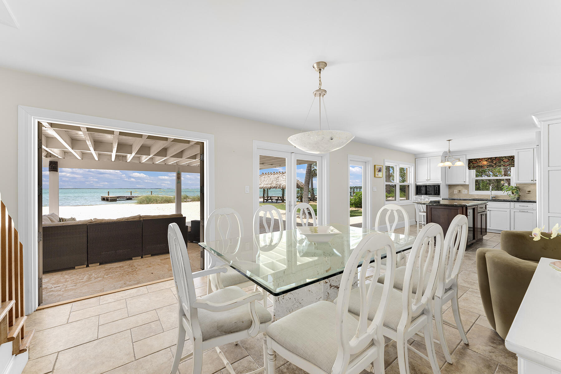 36 Sunset Road Key Largo, FL 33037 - Photo 31 of 55 a living room with furniture a rug and a chandelier