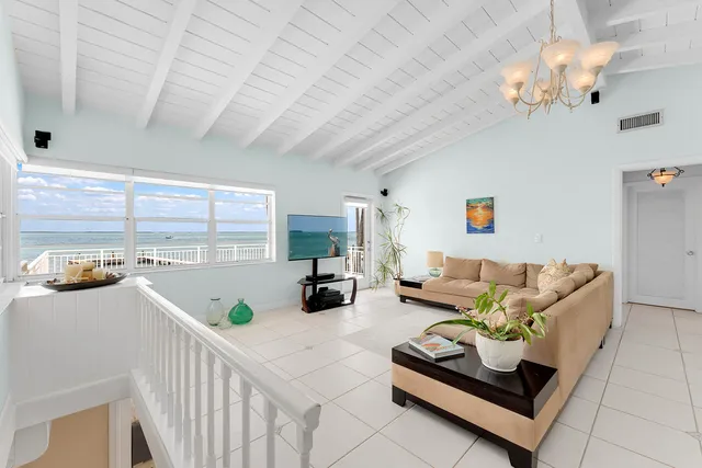 a view of a swimming pool with a table and chairs