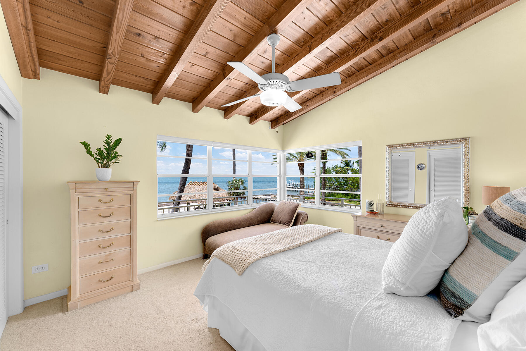 36 Sunset Road Key Largo, FL 33037 - Photo 37 of 55 a large bedroom with a large bed and a large window