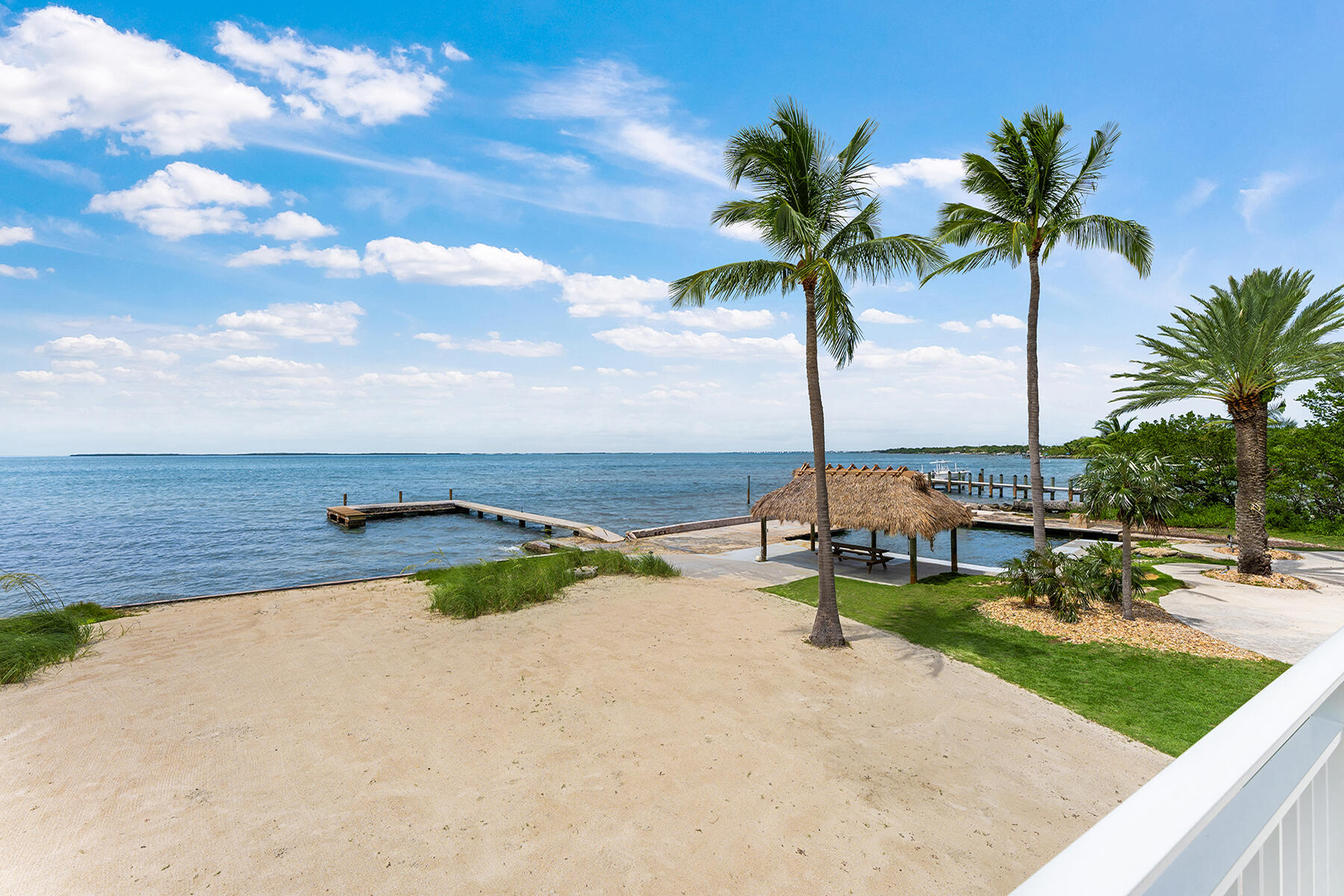 36 Sunset Road Key Largo, FL 33037 - Photo 40 of 55 a view of a swimming pool with a table and chairs