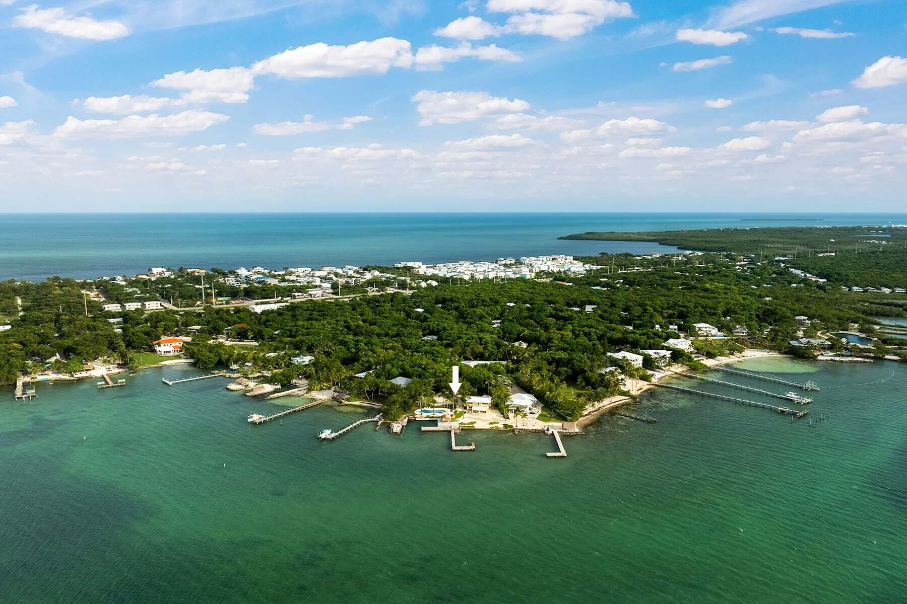 36 Sunset Road Key Largo, FL 33037 - Photo 53 of 55 a view of a lake with houses