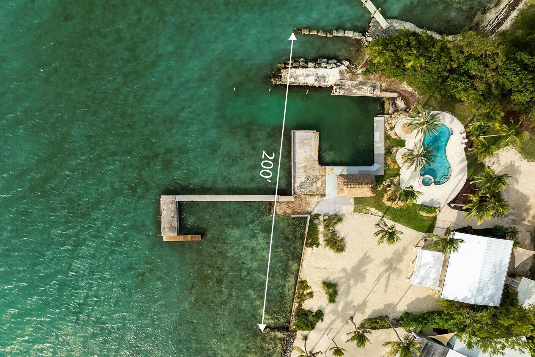 36 Sunset Road Key Largo, FL 33037 - Photo 54 of 55 an aerial view of a house with a yard