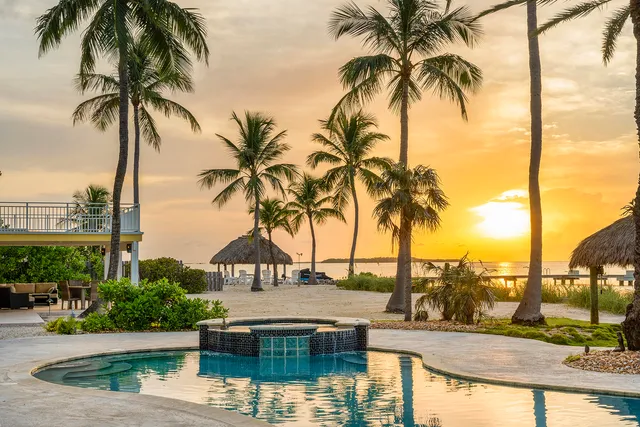 a view of a patio with a table and chairs