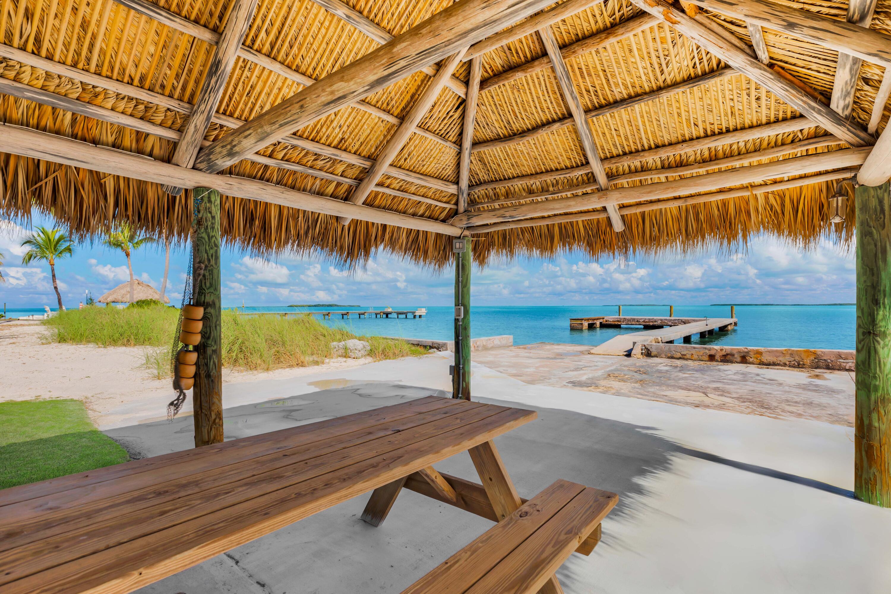 36 Sunset Road Key Largo, FL 33037 - Photo 10 of 55 a view of a backyard tables and swimming pool