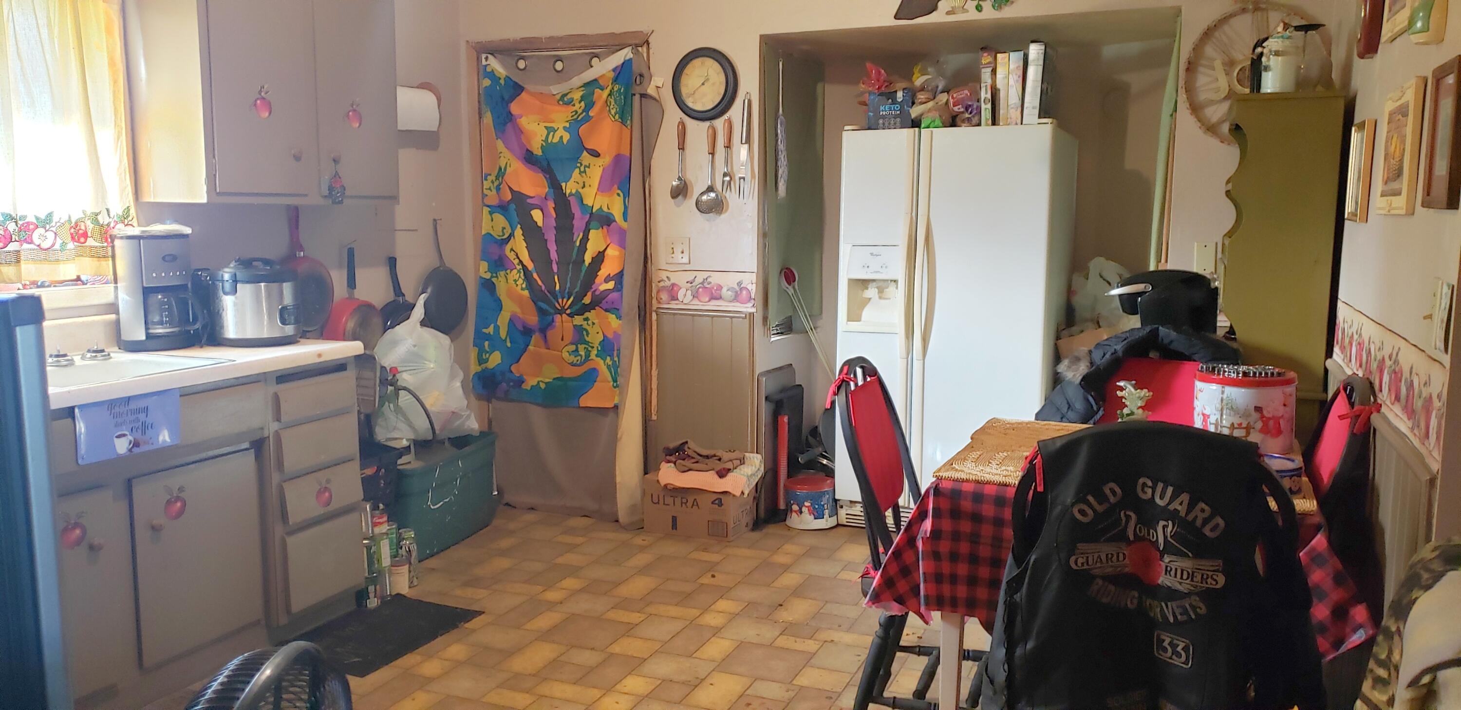 4195 Holland Loop Road Cave Junction, OR 97523 - Photo 11 of 17 a view of walk in closet with clothes