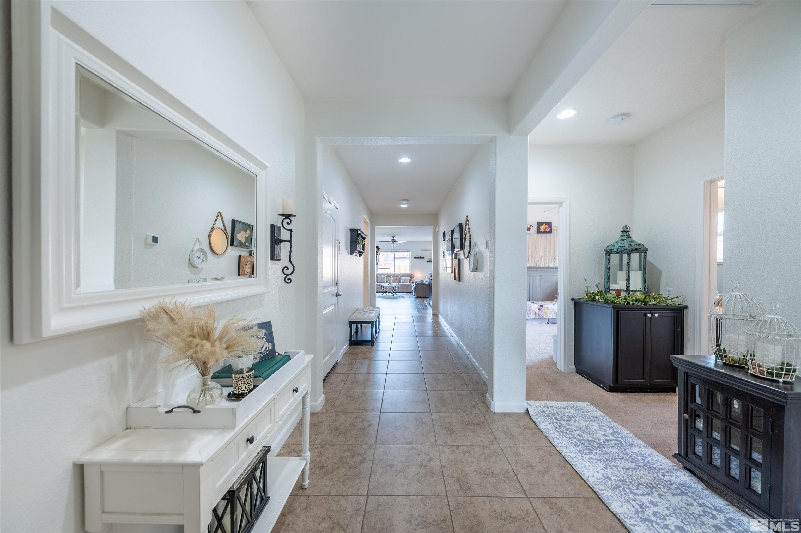 2045 Tawleed Road Reno, NV 89521 - Photo 3 of 33 a living room with furniture and a wooden floor